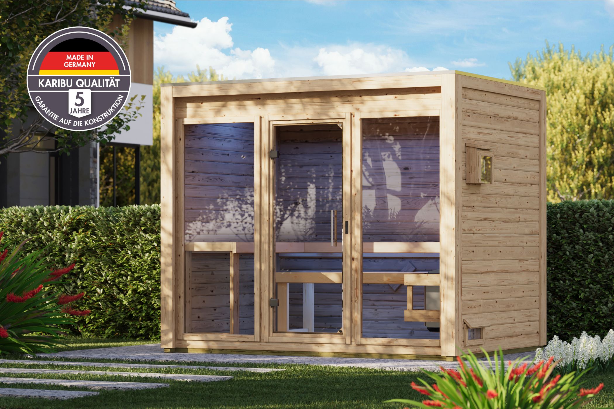 Karibu Saunahaus Hycore 3 als Gartensauna aus Massivholz im Garten mit Glasfront