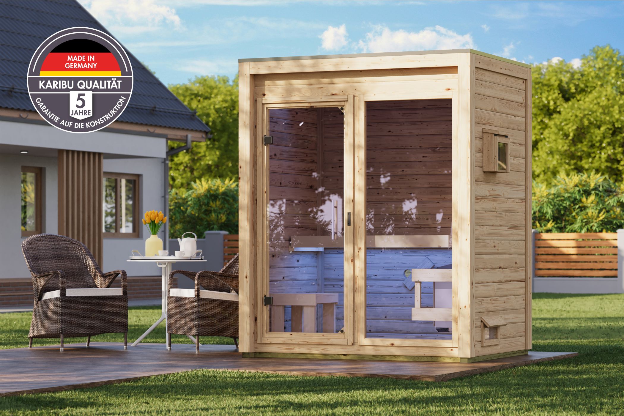 Karibu Saunahaus Hycore 1 als Gartensauna aus Massivholz im Garten mit Glasfront